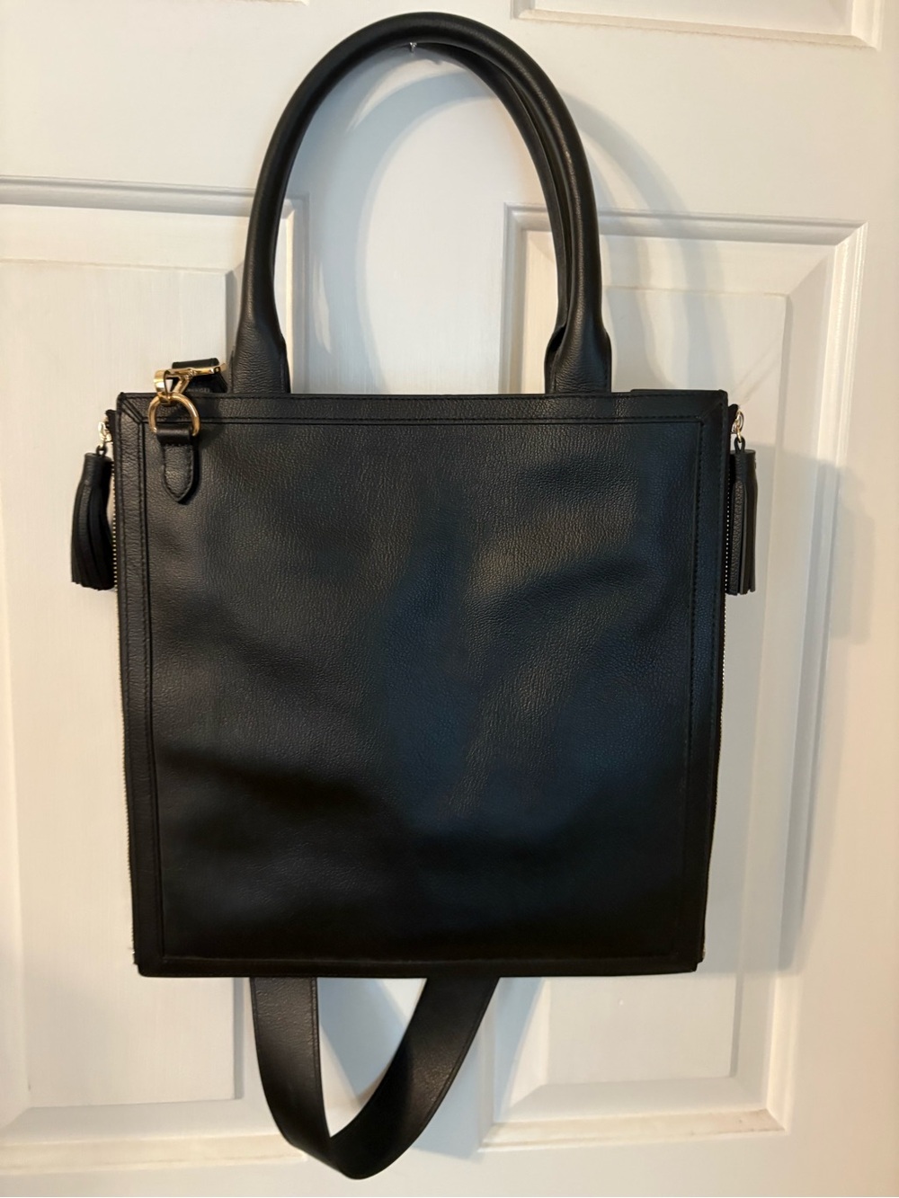 Classic Black Leather Crossbody Tote Bag with Tassel Accent
